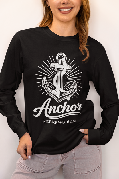 Person wearing a black garment-dyed long sleeve tee with anchor design, standing in a studio setting.