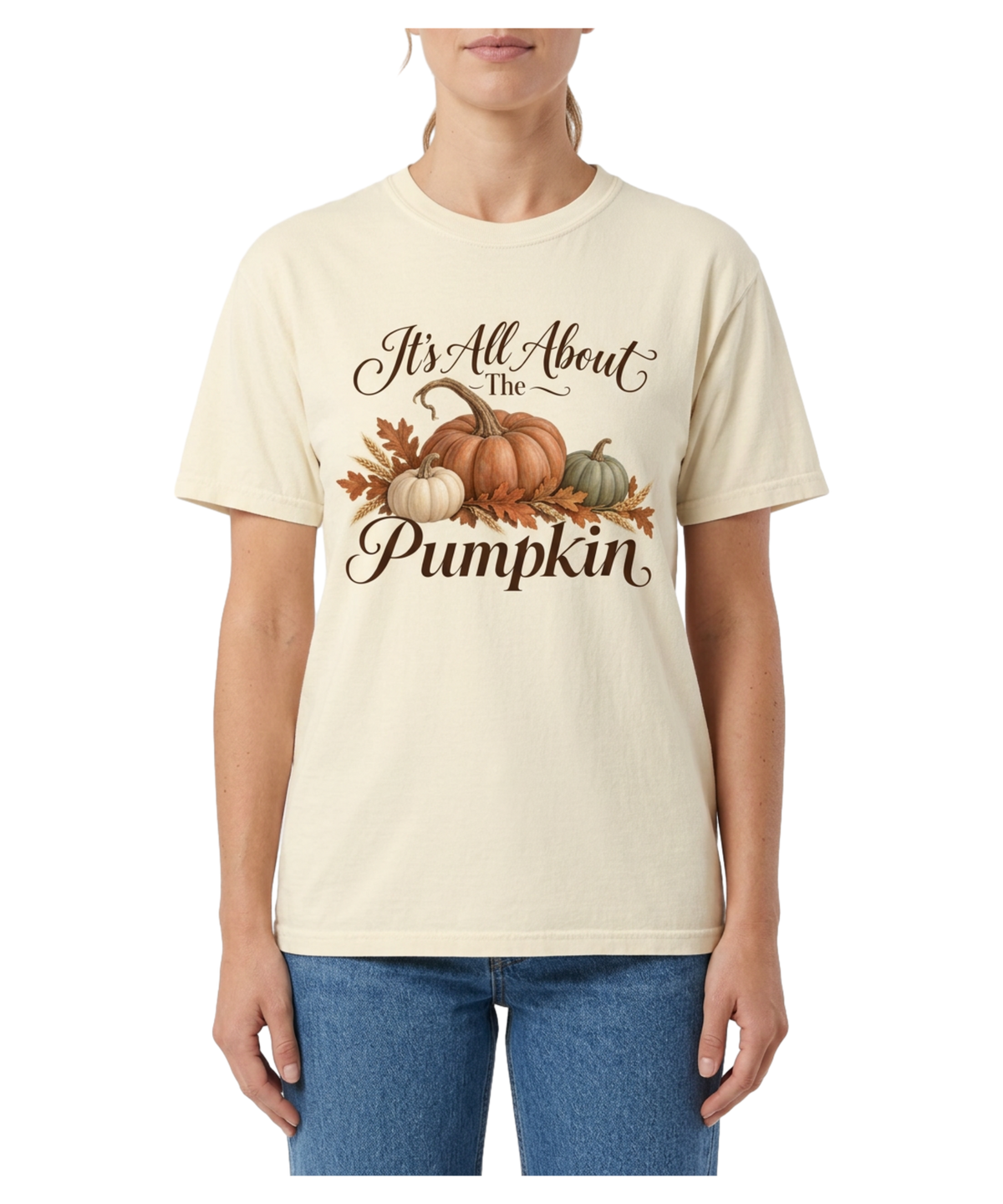 Model wearing an ivory ‘It’s All About the Pumpkin’ tee with pumpkins, autumn leaves, and wheat.
