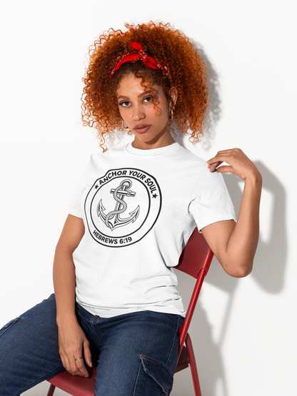 Woman wearing a white t-shirt with an anchor design and text, sitting on a red chair against a white background.