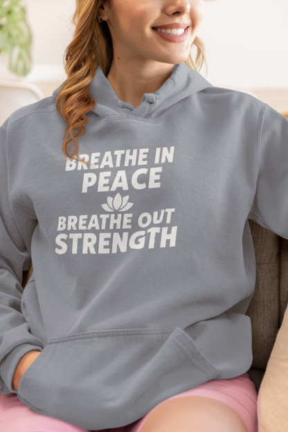 Person wearing a blue jean hoodie with motivational text and a lotus flower symbol.