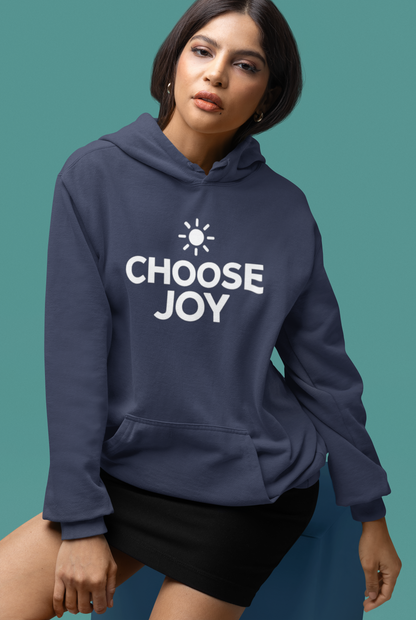 Woman wearing a true navy blue hoodie with 'CHOOSE JOY' text on a teal background