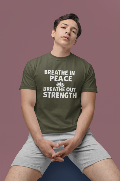 Person wearing a green t-shirt with motivational text on a purple background