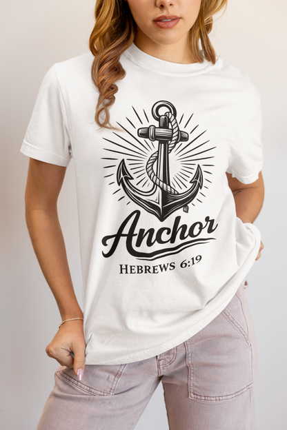 Person wearing a white t-shirt with an anchor design and text.