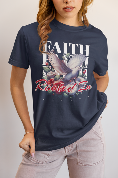 Person wearing a true navy 'Rooted In Faith' garment-dyed tee featuring a dove and floral graphic.