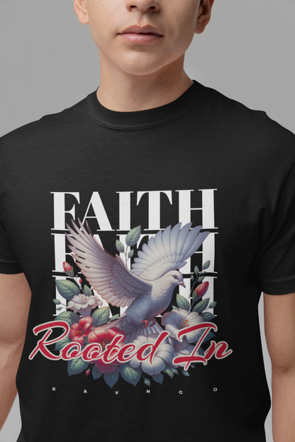 Person wearing a black 'Rooted In Faith' garment-dyed tee featuring a dove and floral graphic.