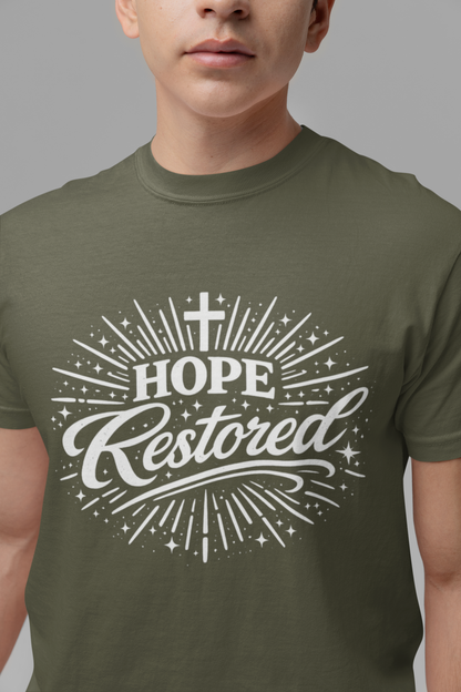 Person wearing a green t-shirt with 'Hope Restored' design on a gray background