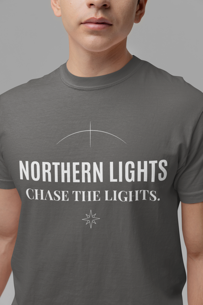 Person wearing a pepper t-shirt with 'Northern Lights Chase the Lights' text and design.