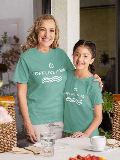 Woman and young girl wearing matching teal t-shirts with 'OFFLINE MODE' text.