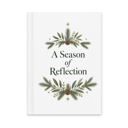 A Season of Reflection white hardcover journal with evergreen branches, pinecones, gold stars, and dark-green lettering.