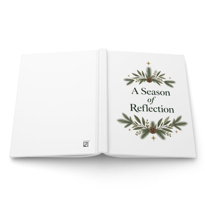 A Season of Reflection journal showing the botanical front cover and plain white back with a small production code.