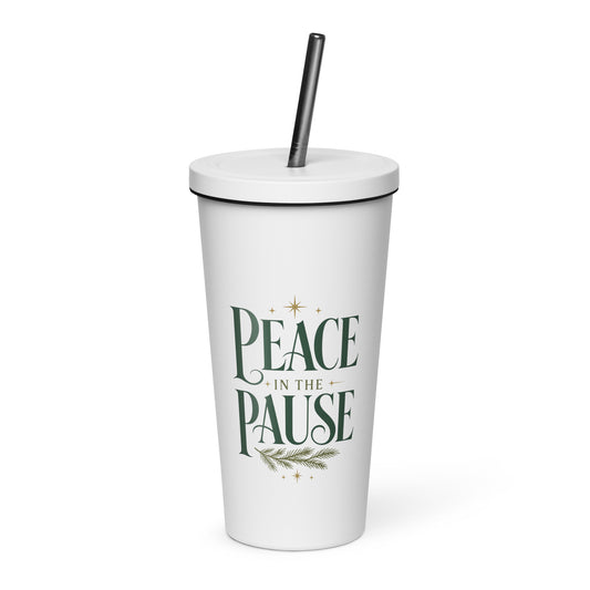 White “Peace in the Pause” tumbler with a lid and straw, featuring forest-green lettering, gold stars, and an evergreen sprig.
