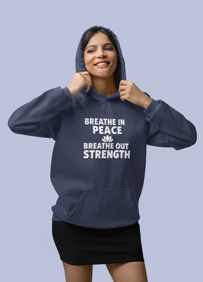 Woman wearing a true navy blue hoodie with motivational text on a light purple background