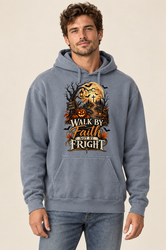 Model wearing a Blue Jean Walk by Faith Not by Fright hoodie with a golden moon, pumpkins, cross, and autumn lettering on the front.