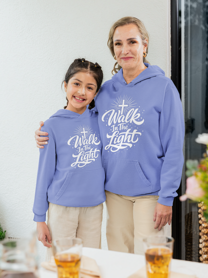 Woman and young girl wearing matching flo blue hoodies with 'Walk In The Light' text.
