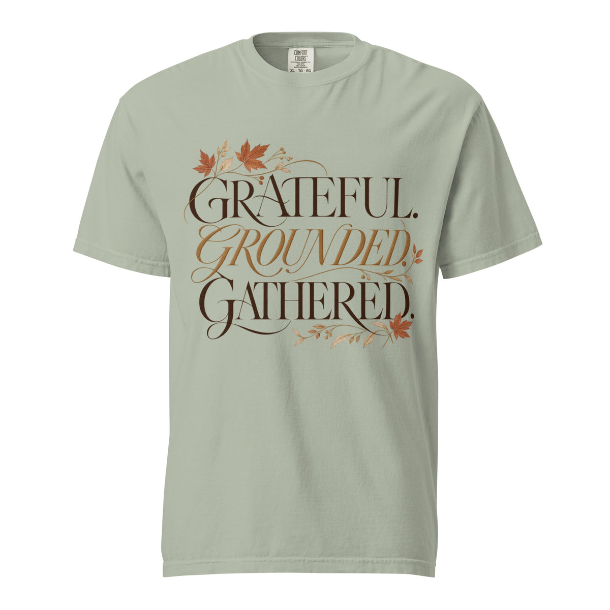 Bay green Comfort Colors tee with “Grateful. Grounded. Gathered.” lettering and autumn botanical accents on the front.