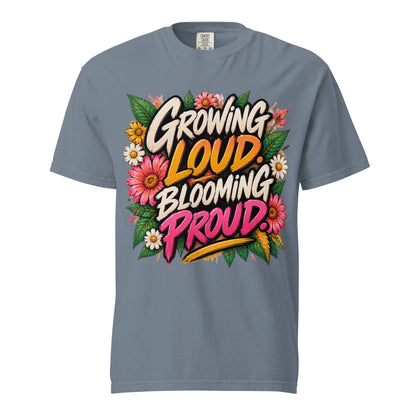 Blue Jean Growing Loud, Blooming Proud tee with cream, orange, and pink lettering surrounded by flowers and green leaves.