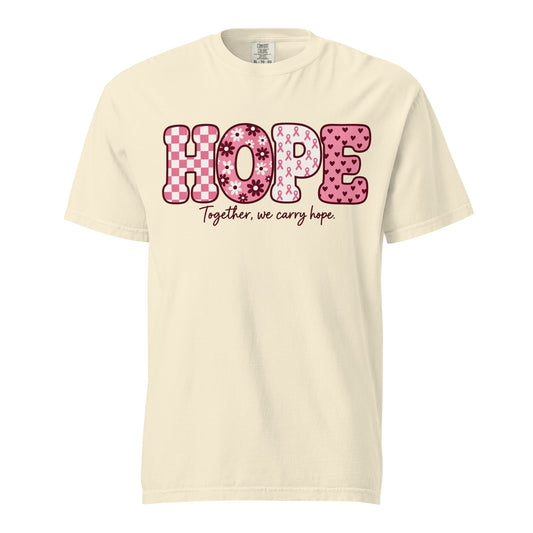 Ivory garment-dyed tee with bold pink patterned “HOPE” lettering, front view.