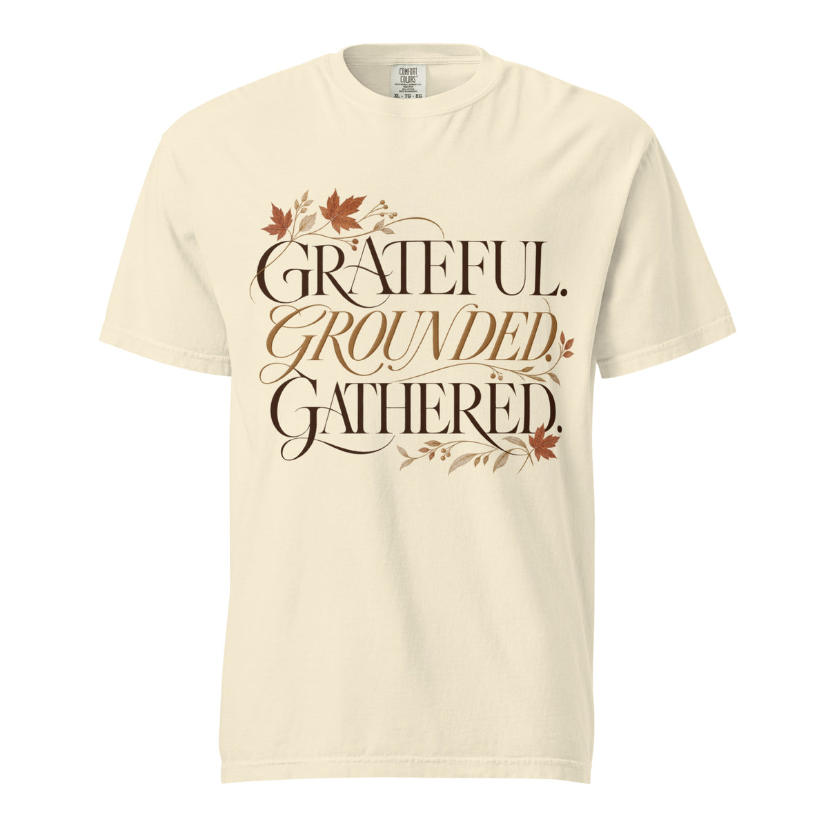 Ivory Comfort Colors tee with “Grateful. Grounded. Gathered.” lettering and autumn botanical accents on the front.