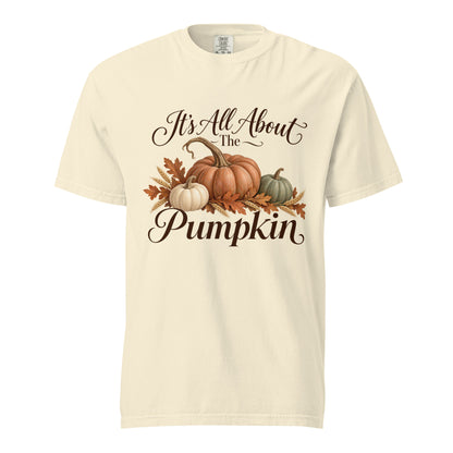 Ivory tee featuring ‘It’s All About the Pumpkin’ lettering, three pumpkins, autumn leaves, and wheat.