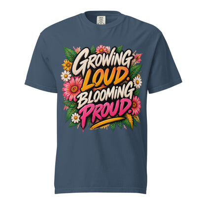 Midnight blue Growing Loud, Blooming Proud tee with cream, orange, and pink lettering surrounded by flowers and green leaves.