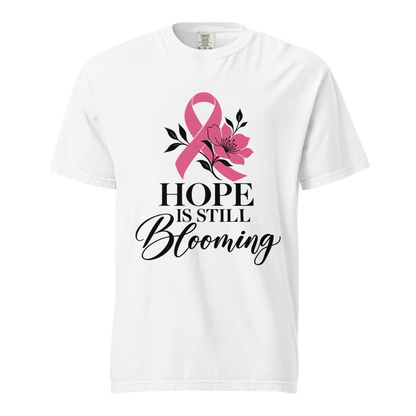 White T-shirt with the pink-ribbon floral “Hope Is Still Blooming” design, front view.