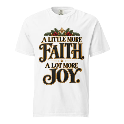 A Little More Faith, A Lot More Joy” Christmas tee with black-and-gold lettering, festive greenery, red berries, and gold stars.
