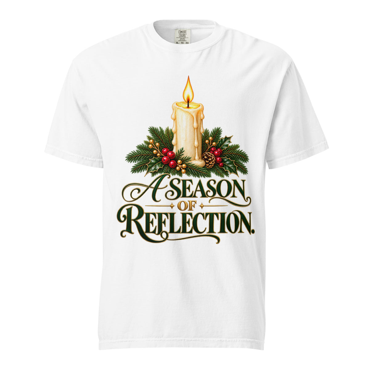 Front view of a White “A Season of Reflection” Christmas tee featuring a lit candle, evergreen branches, red berries, a pinecone, and green-and-gold lettering.