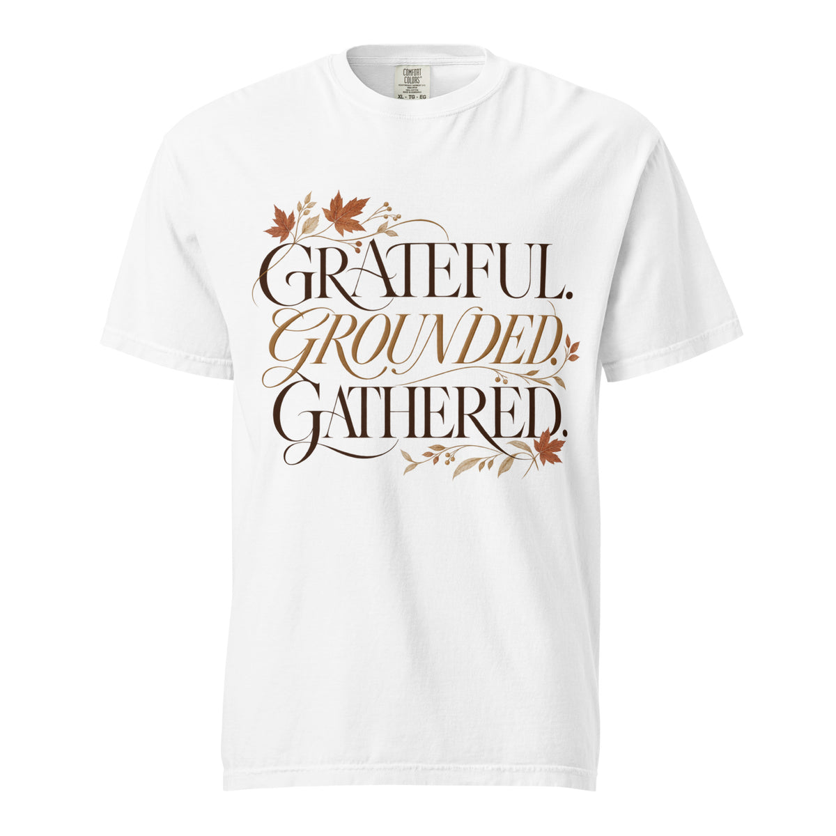 White Comfort Colors tee with “Grateful. Grounded. Gathered.” lettering and autumn botanical accents on the front.