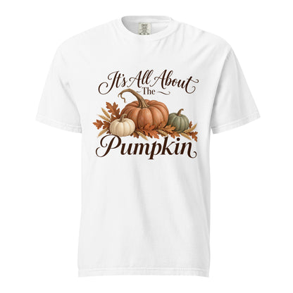 White ‘It’s All About the Pumpkin’ tee with dark script, three pumpkins, autumn leaves, and wheat.