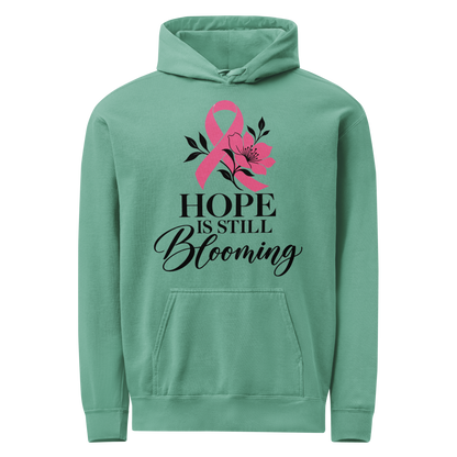Seafoam hoodie with black “Hope Is Still Blooming” lettering, a pink awareness ribbon, and floral accents on the front