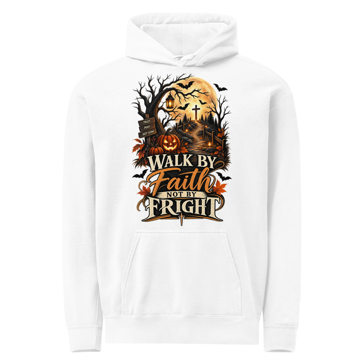 White hoodie with ‘Walk by Faith Not by Fright’ lettering, a golden moon, pumpkins, lanterns, and a cross along a woodland path.