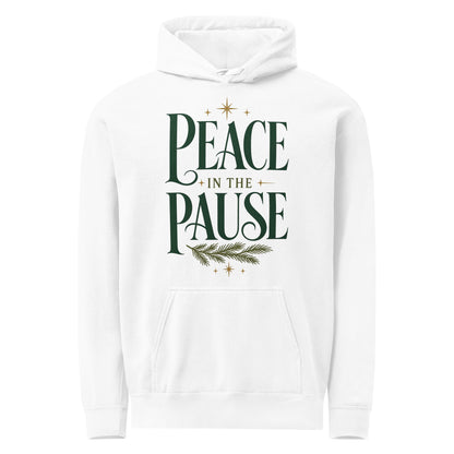 White Peace in the Pause hoodie with forest-green lettering, an evergreen sprig, gold stars, and a front pouch pocket.
