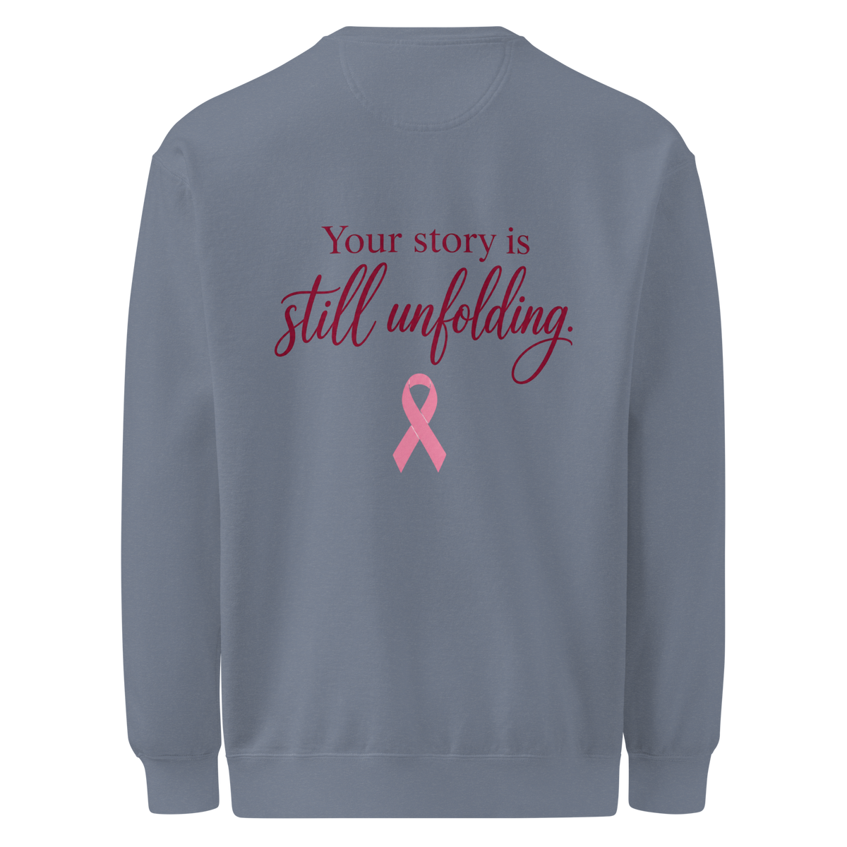 Back of Blue Jean sweatshirt with burgundy “Your story is still unfolding” lettering above a pink breast cancer awareness ribbon.