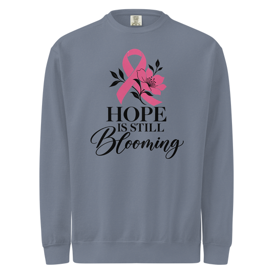 Blue Jean sweatshirt with black “Hope Is Still Blooming” lettering, a pink awareness ribbon, and floral accents on the front