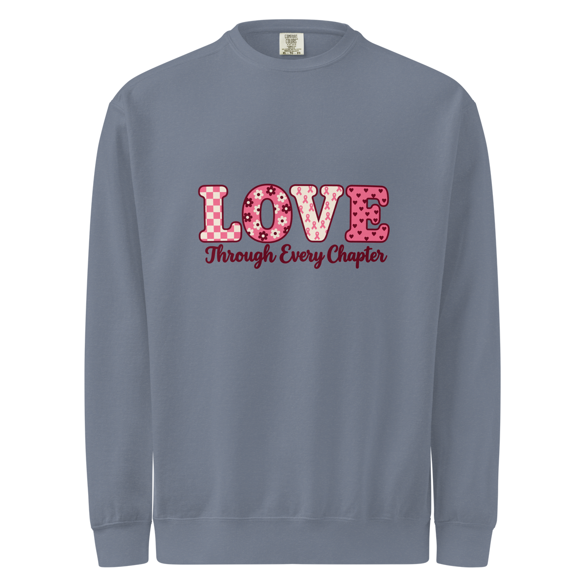 Blue Jean sweatshirt with pink patterned LOVE lettering and burgundy “Through Every Chapter” script on the front.