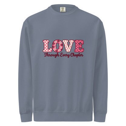 Blue Jean sweatshirt with pink patterned LOVE lettering and burgundy “Through Every Chapter” script on the front.