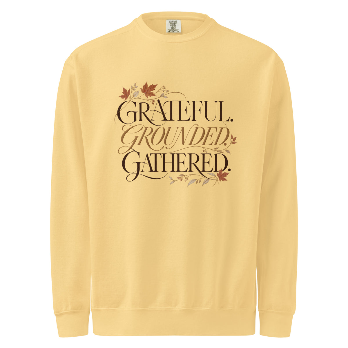 Butter ‘Grateful. Grounded. Gathered.’ sweatshirt with dark and muted gold lettering and autumn leaves.