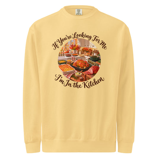 Butter yellow sweatshirt with a Thanksgiving kitchen scene and “If You’re Looking for Me, I’m in the Kitchen” lettering.