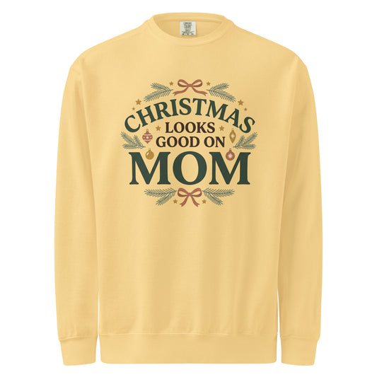 Butter yellow sweatshirt with “Christmas Looks Good on Mom” lettering, evergreen sprigs, ornaments, and terracotta bows.
