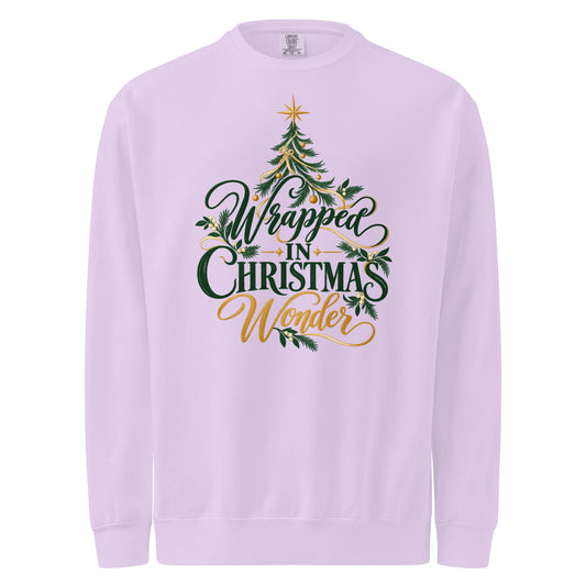 Pale pink-lilac Wrapped in Christmas Wonder sweatshirt with green lettering, a Christmas tree, and gold accents.