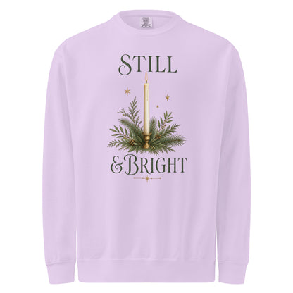 Orchid purple Still & Bright Christmas sweatshirt with a candle, evergreen branches, gold stars, and dark green lettering.