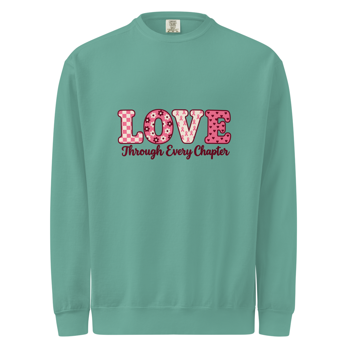 Seafoam sweatshirt with pink patterned LOVE lettering and burgundy “Through Every Chapter” script on the front.
