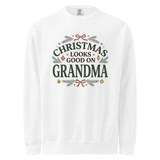 White sweatshirt with “Christmas Looks Good on Grandma” lettering, evergreen sprigs, ornaments, and terracotta bows.